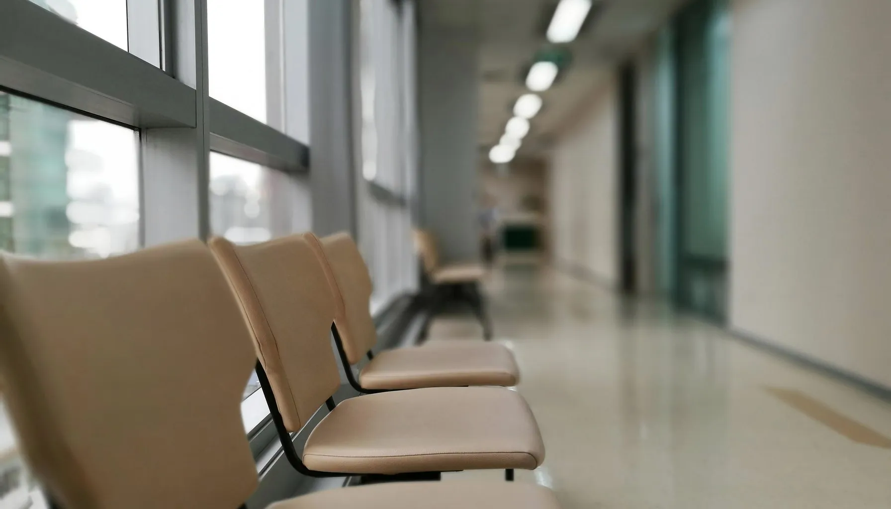 A modern private clinic corridor in soft daylight